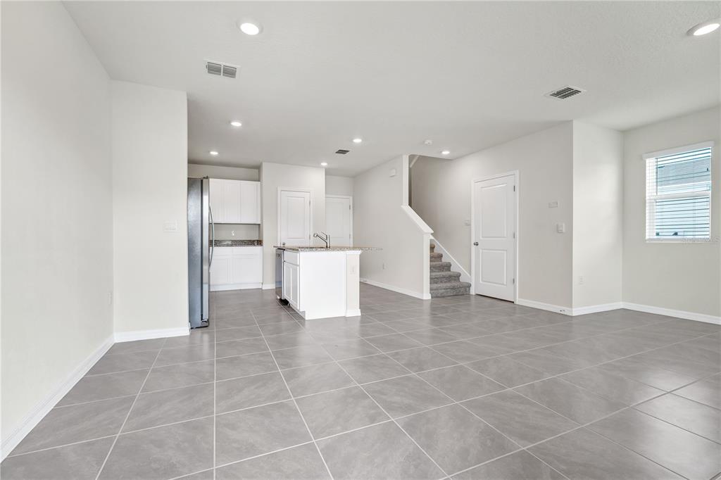 5650 Anders Way St. Cloud, FL 34771 - Photo 7 of 39 a view of a kitchen with a sink and an open kitchen
