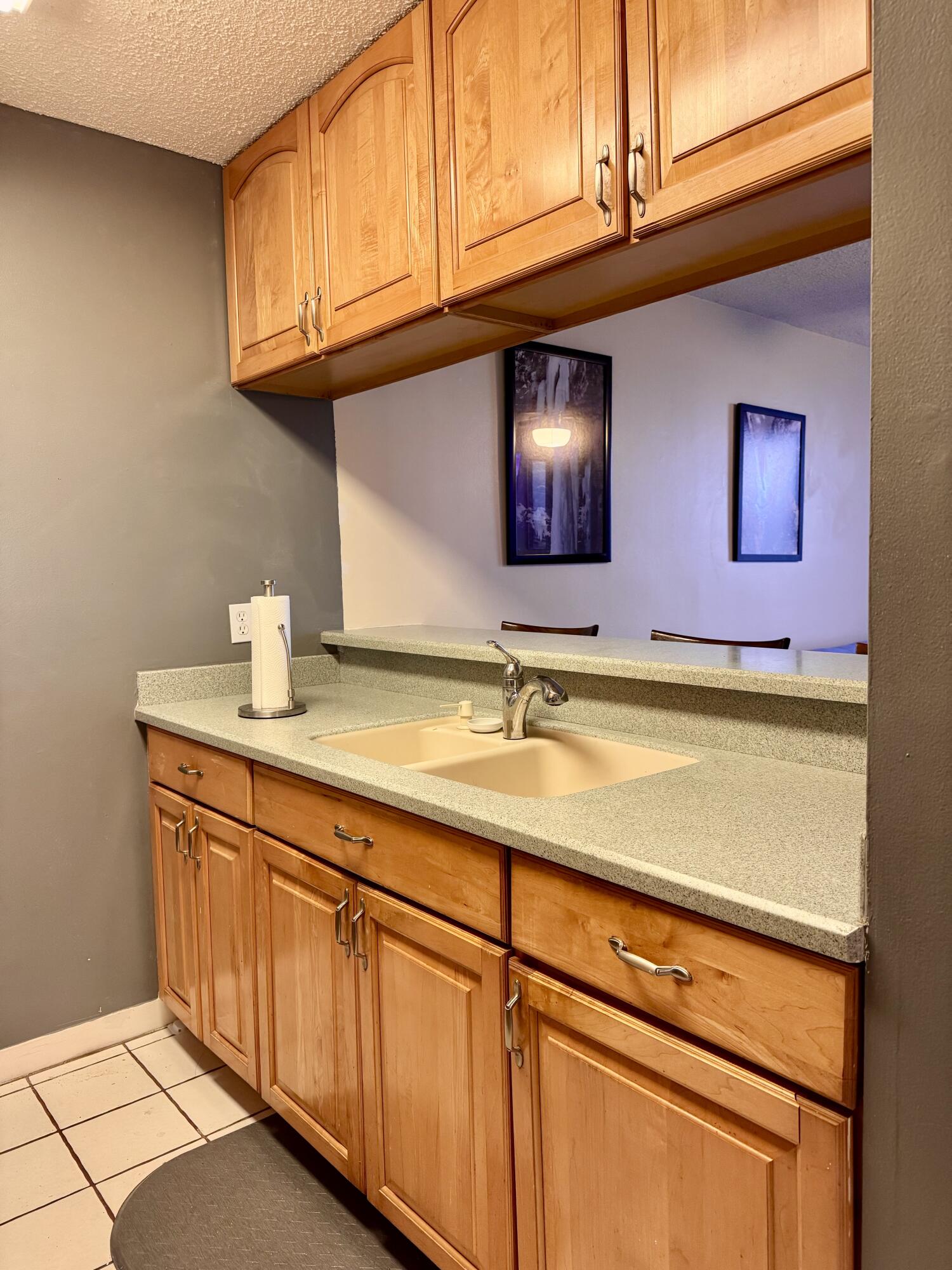 3312 Northside Drive, Unit 405 Key West, FL 33040 - Photo 7 of 25 a kitchen with stainless steel appliances granite countertop a sink and cabinets