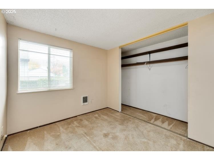 159 Southwest Florence Avenue Gresham, OR 97080 - Photo 14 of 24 a view of an empty room with wooden floor and a window