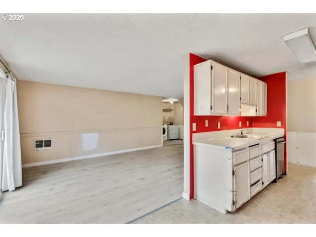 a bathroom with a sink vanity and mirror