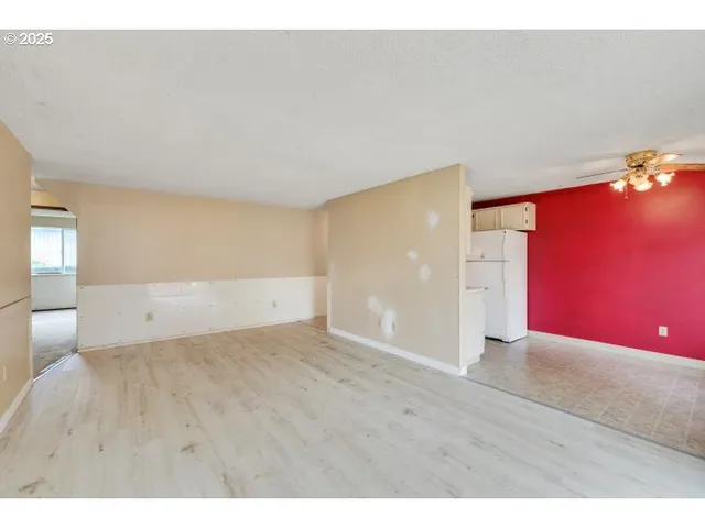 a view of an empty room and window