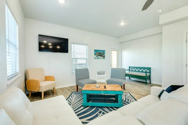 a living room with furniture and a window