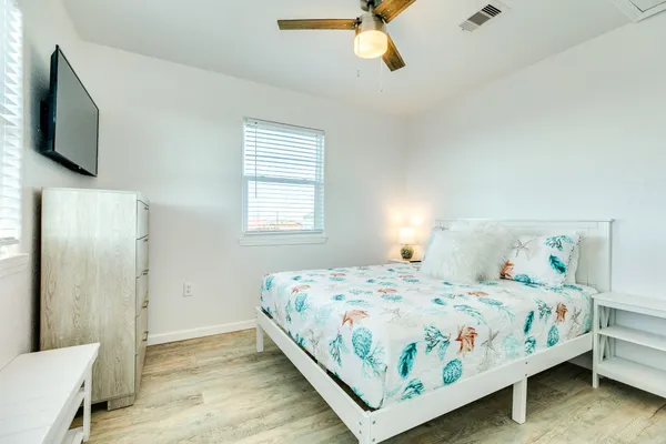 a bedroom with a bed and window