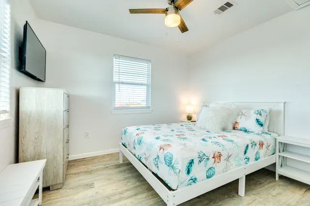 a bedroom with a bed and window