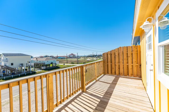a view of wooden balcony with wooden floor