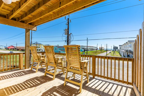 a view of a balcony with chairs