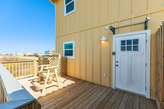 a kitchen with a sink stove and white cabinets