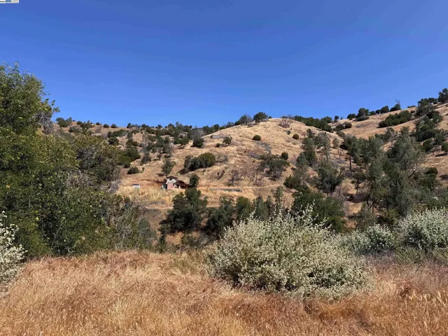 a view of a large building with a mountain in the background