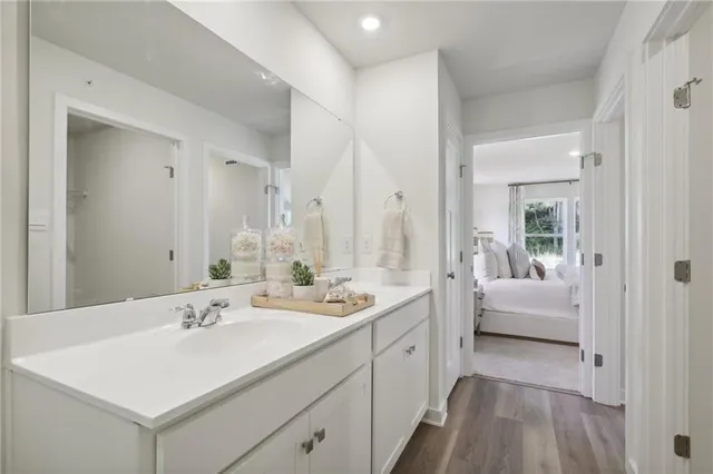 a en suite bathroom with a sink and a mirror