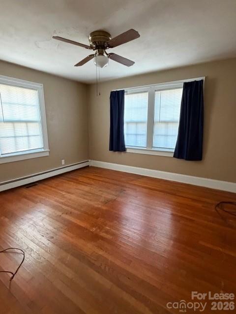 1015 20th Street Northeast Hickory, NC 28601 - Photo 13 of 13 an empty room with wooden floor and windows