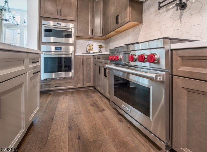20 Whitaker Lane Far Hills, NJ 07931 - Photo 17 of 18 a kitchen with stainless steel appliances granite countertop a stove and a refrigerator
