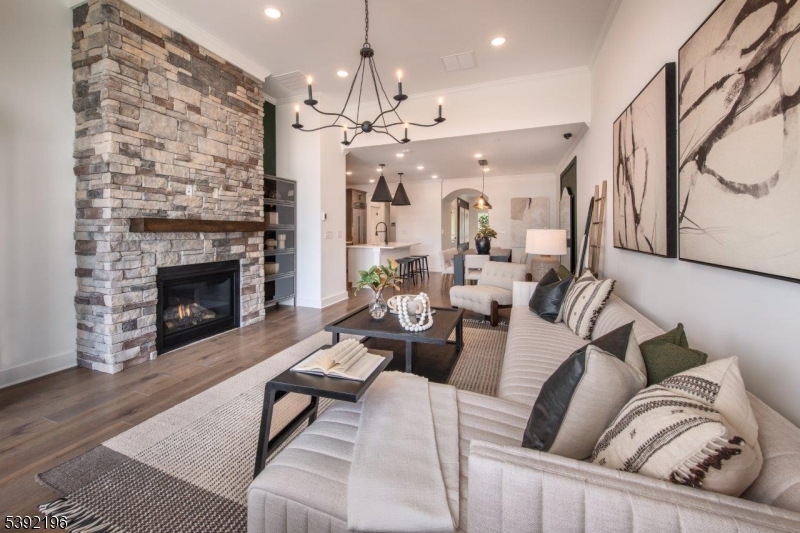 20 Whitaker Lane Far Hills, NJ 07931 - Photo 3 of 18 a living room with furniture a fireplace and a chandelier