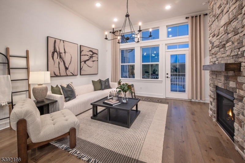 20 Whitaker Lane Far Hills, NJ 07931 - Photo 5 of 18 a living room with furniture a chandelier and wooden floor