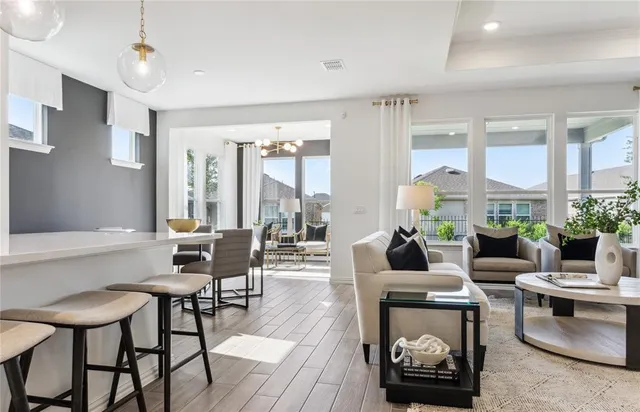 a living room with furniture and a large window