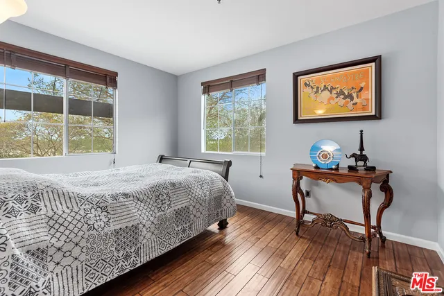 a bedroom with bed and window