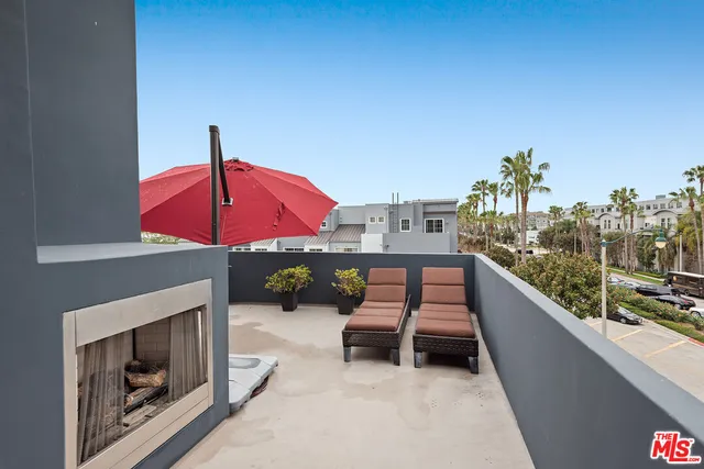 a outdoor space with patio the couches and a potted plant