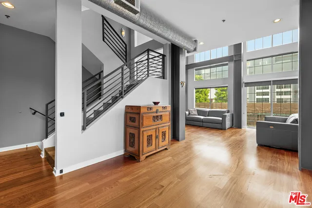 a view of an entryway with wooden floor