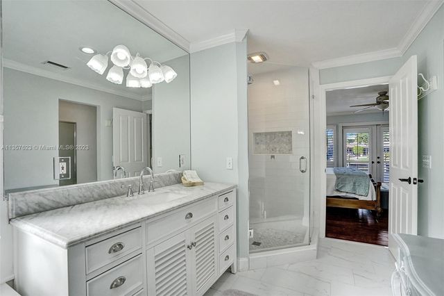 a bathroom with a sink a vanity and a mirror