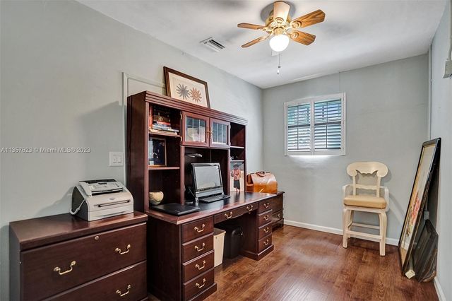 a room with furniture and wooden floor