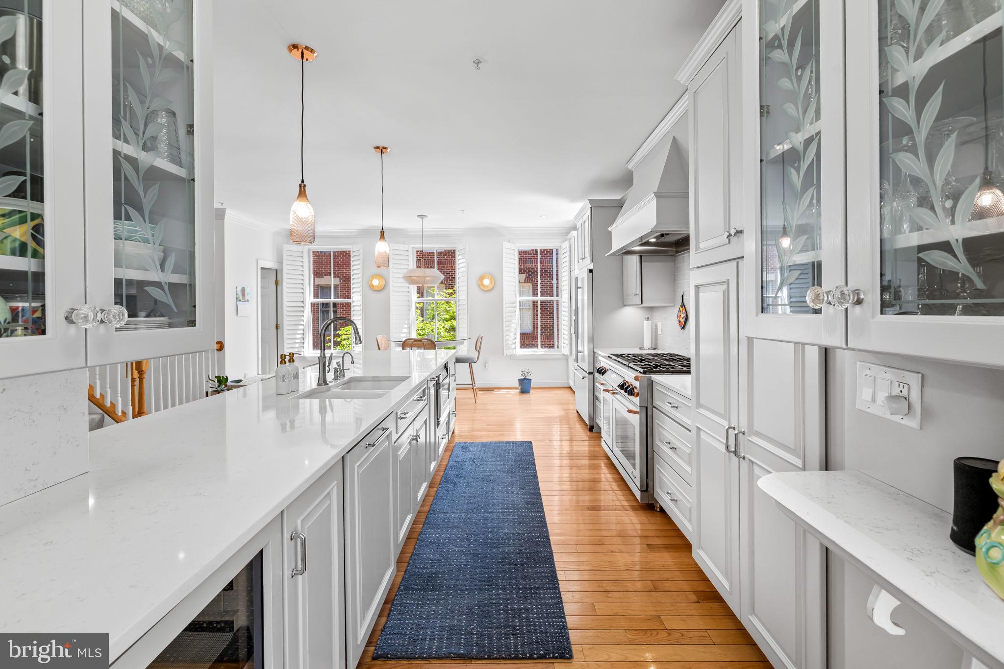 2331 Boston Street, Unit 1 Baltimore, MD 21224 - Photo 25 of 74 a view of a kitchen with stainless steel appliances a sink and cabinets
