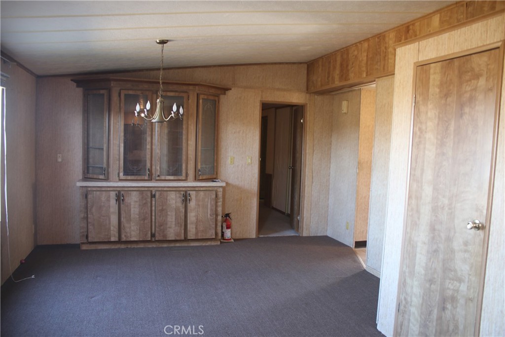 1147 Cherokee Trail Yucca Valley, CA 92284 - Photo 13 of 27 a view of an empty room with a window