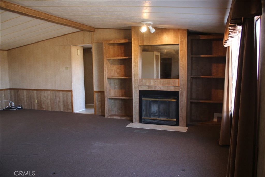 1147 Cherokee Trail Yucca Valley, CA 92284 - Photo 2 of 27 a view of empty room with a fireplace