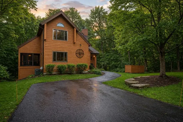 a front view of a house with a yard