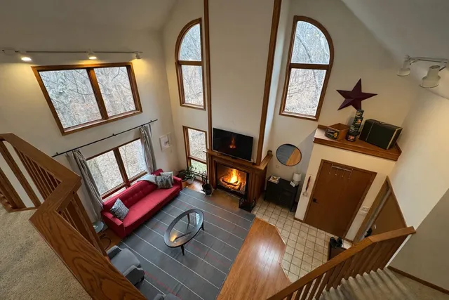 a living room with furniture or stairs and a wooden floor