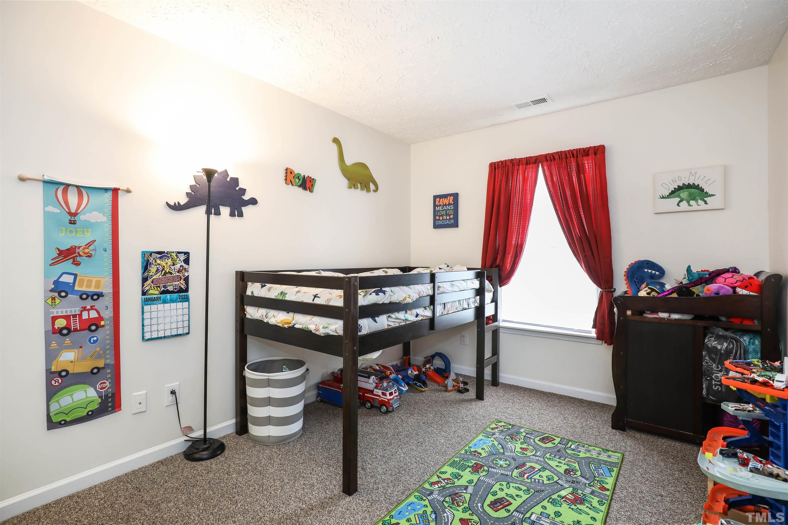 5805 Wynmore Road Raleigh, NC 27610 - Photo 18 of 20 a view of game room with racks and toys