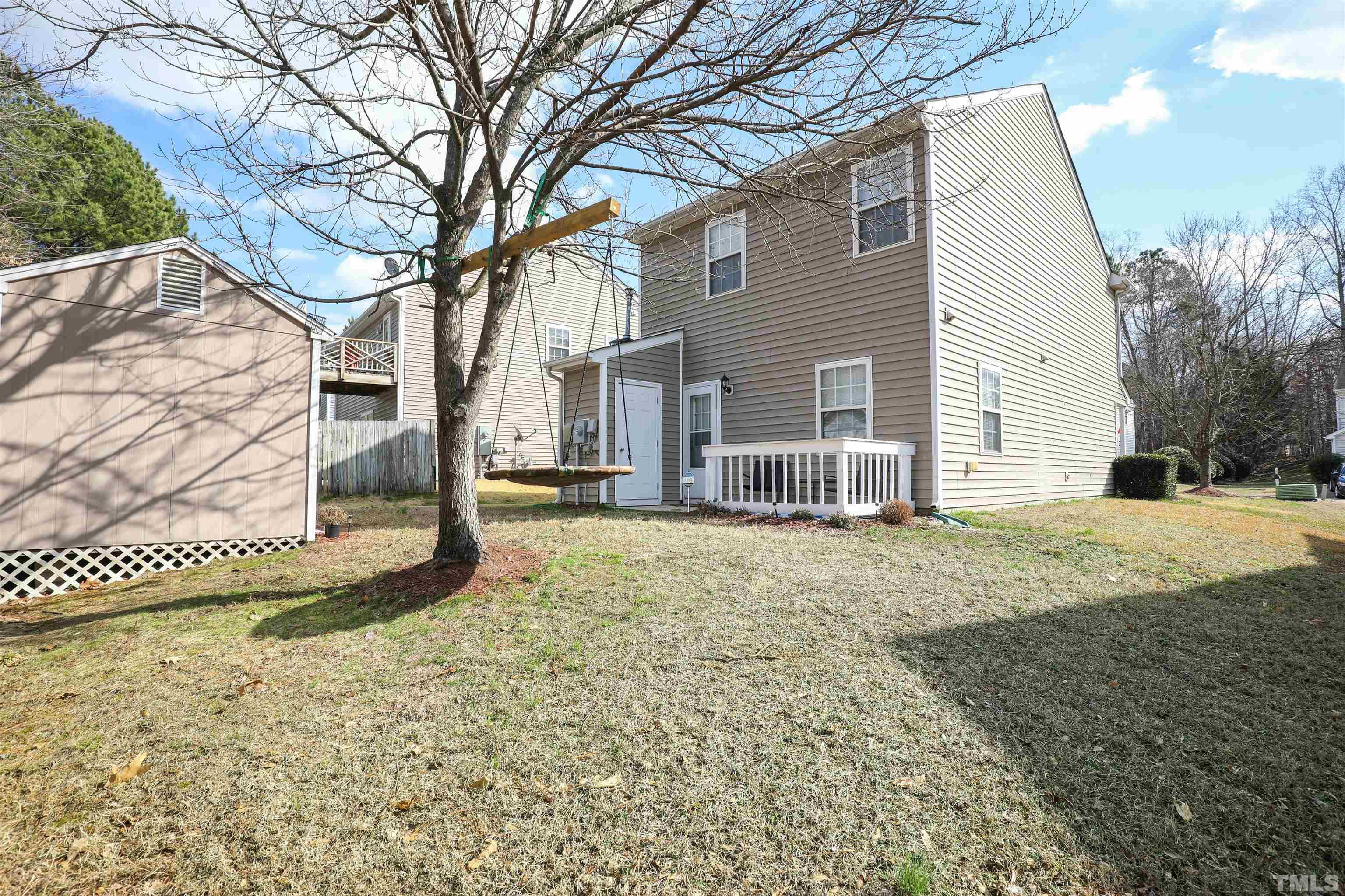 5805 Wynmore Road Raleigh, NC 27610 - Photo 4 of 20 a view of a house with a yard