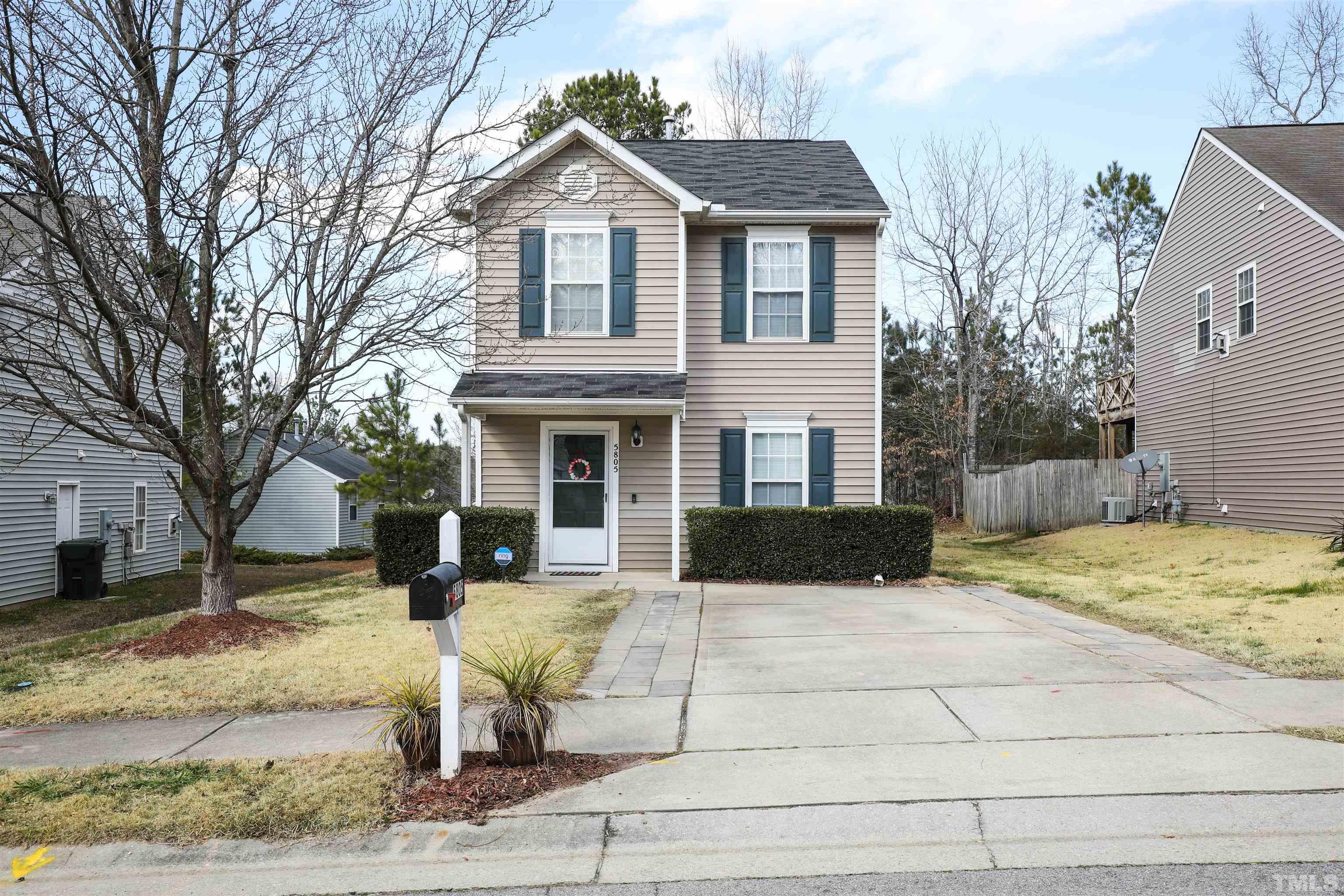 5805 Wynmore Road Raleigh, NC 27610 - Photo 6 of 20 a view of a yard in front of a house