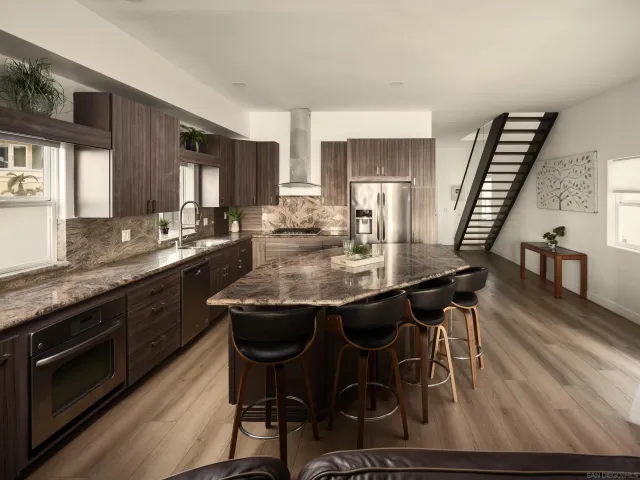 a dining table with chairs and wooden floor