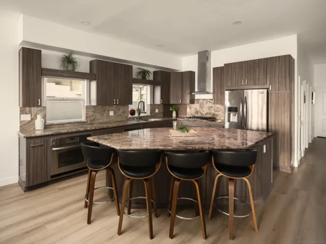 a bathroom with a shower toilet and sink