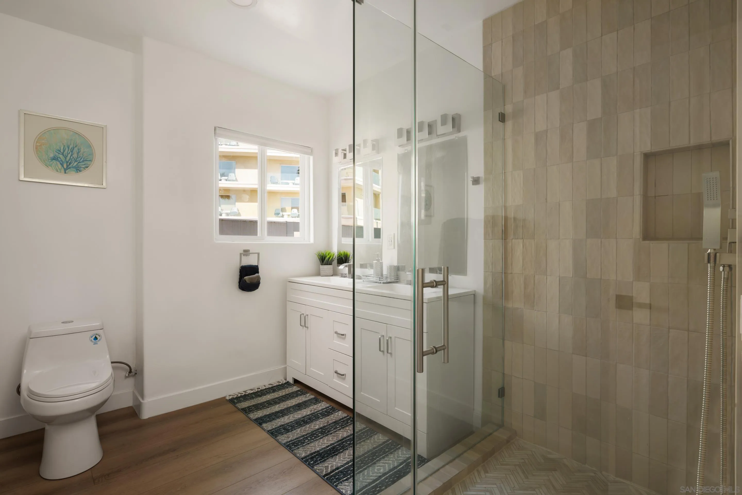 806 Ocean Lane Imperial Beach, CA 91932 - Photo 14 of 59 a bathroom with a shower toilet and sink