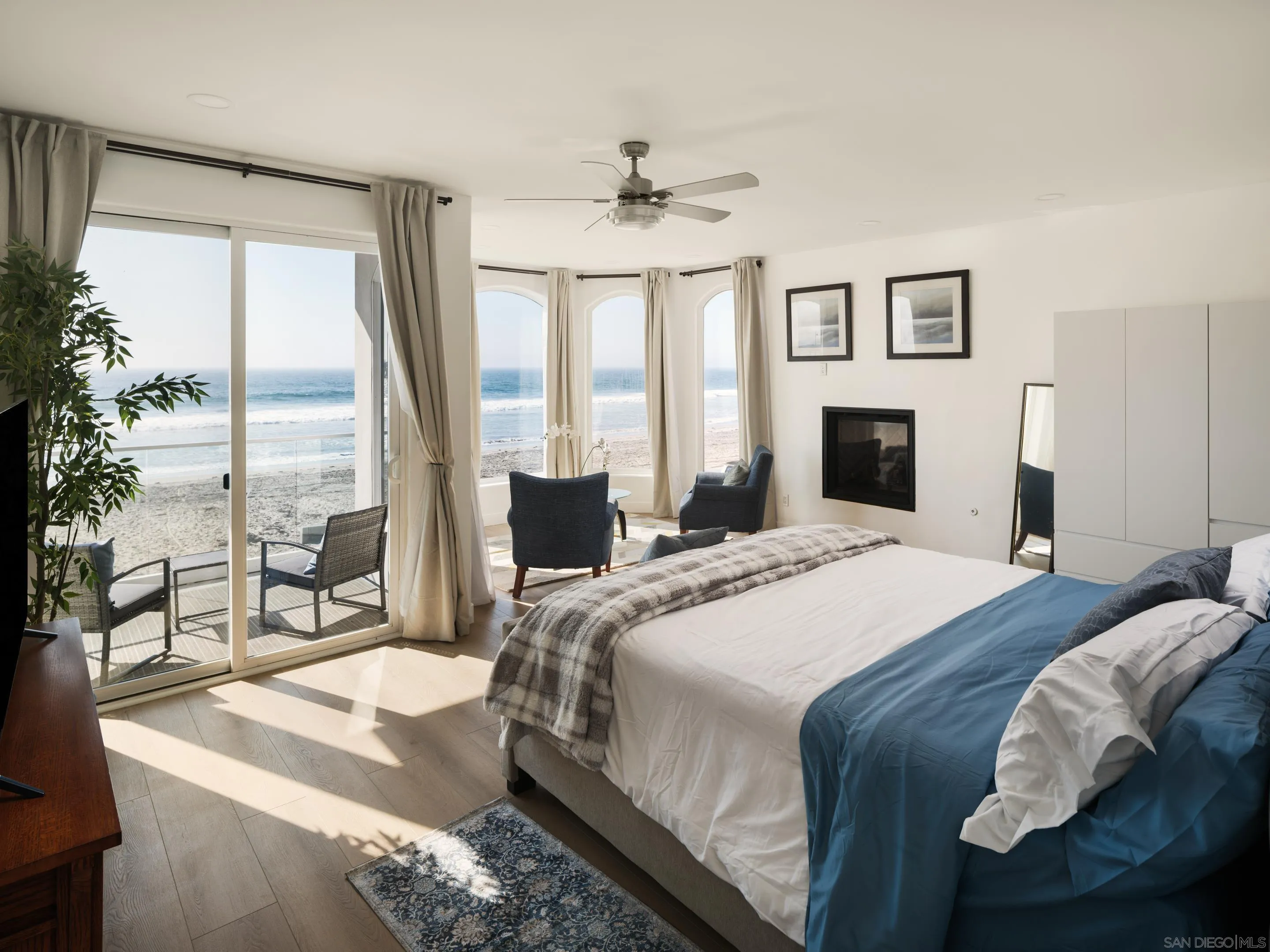 806 Ocean Lane Imperial Beach, CA 91932 - Photo 16 of 59 a bedroom with a bed and large windows