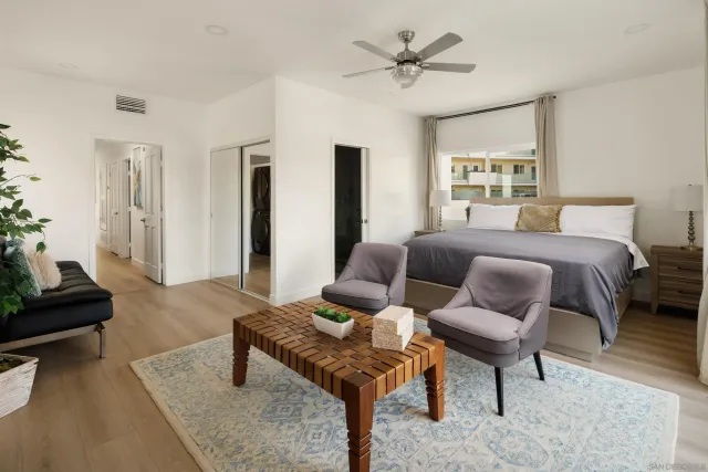 a bedroom with bed and a couch