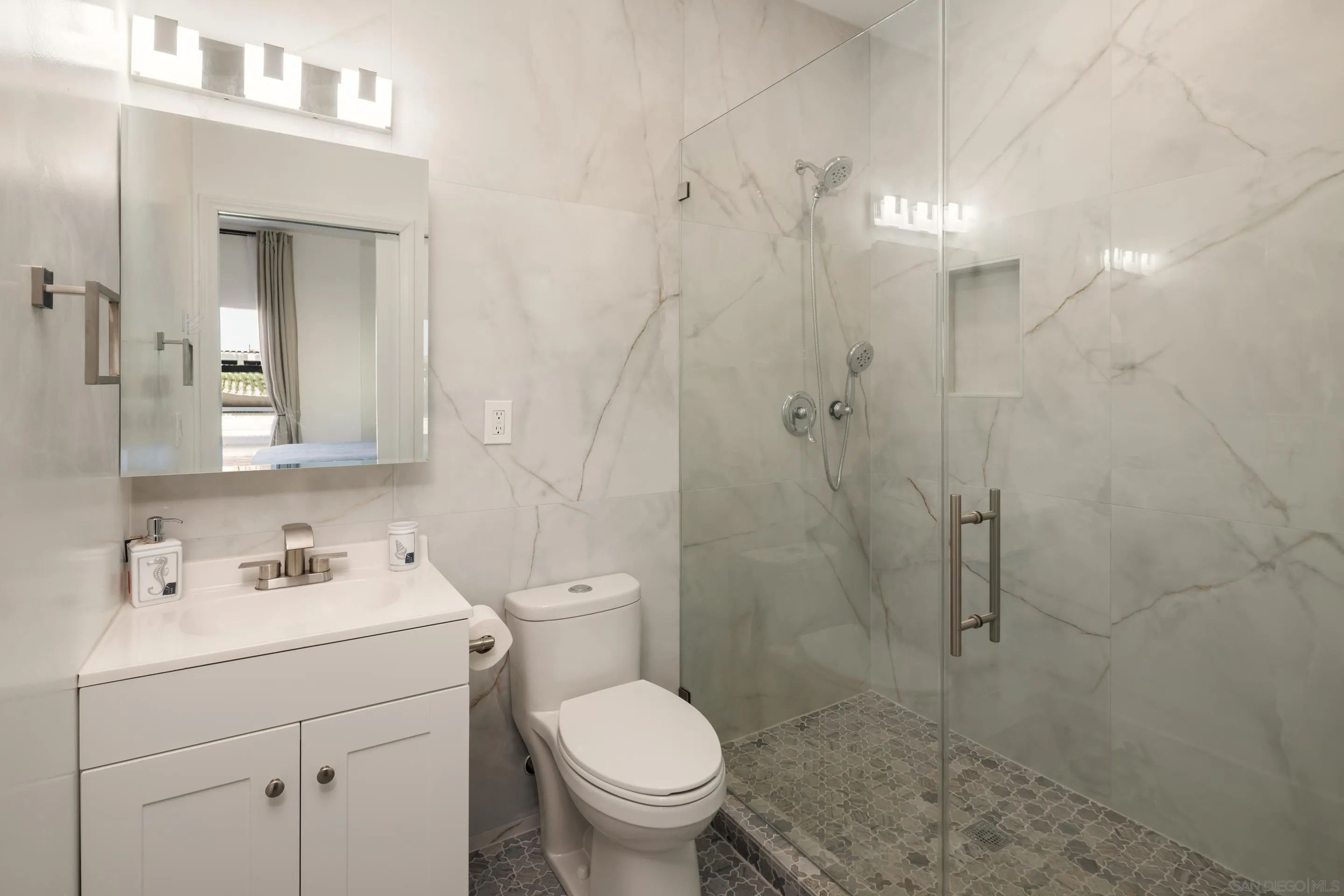 806 Ocean Lane Imperial Beach, CA 91932 - Photo 25 of 59 a bathroom with a sink a toilet and shower