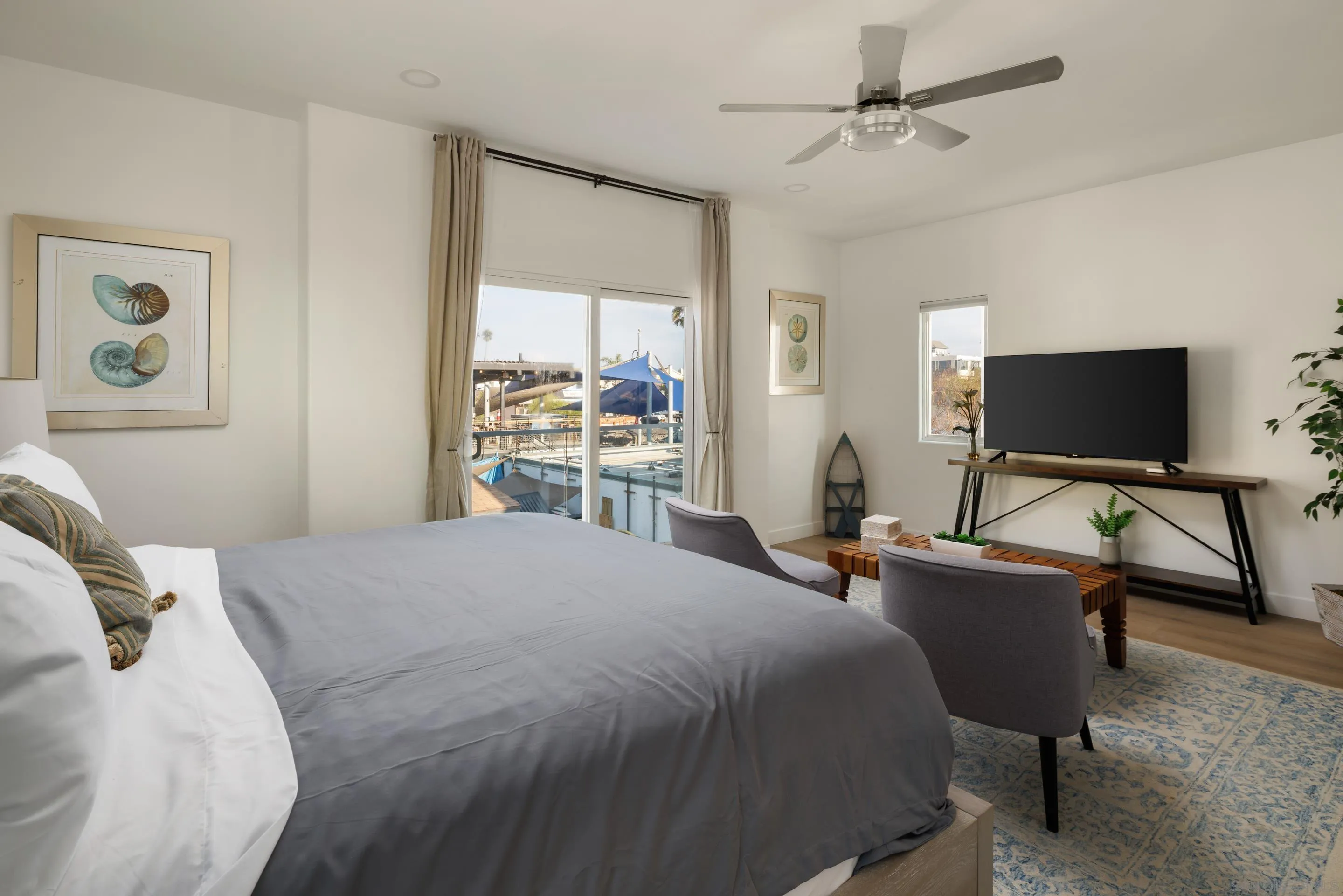 806 Ocean Lane Imperial Beach, CA 91932 - Photo 27 of 59 a bedroom with a bed and a flat screen tv