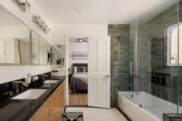 a view of a bathroom with a sink and mirror