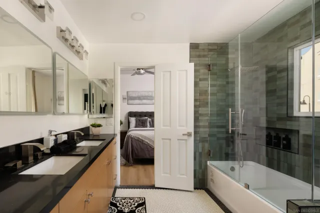 a view of a bathroom with a sink and mirror