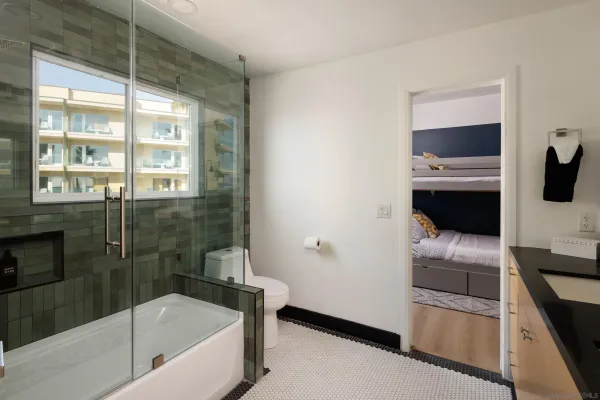 a bedroom with a large bed and a window