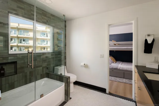 a bedroom with a large bed and a window