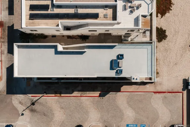 a view of residential houses with a street