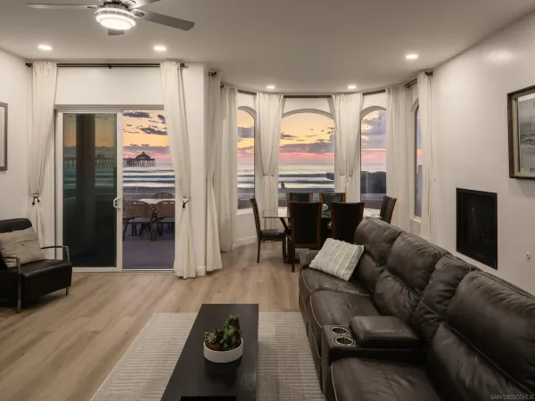 a terrace with outdoor seating and city view