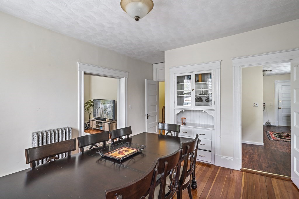 105 Walnut Street Somerville, MA 02145 - Photo 14 of 37 a living room with furniture and wooden floor