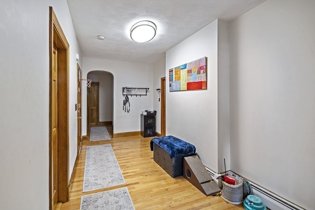 105 Walnut Street Somerville, MA 02145 - Photo 2 of 37 a very nice looking room with a wooden floor