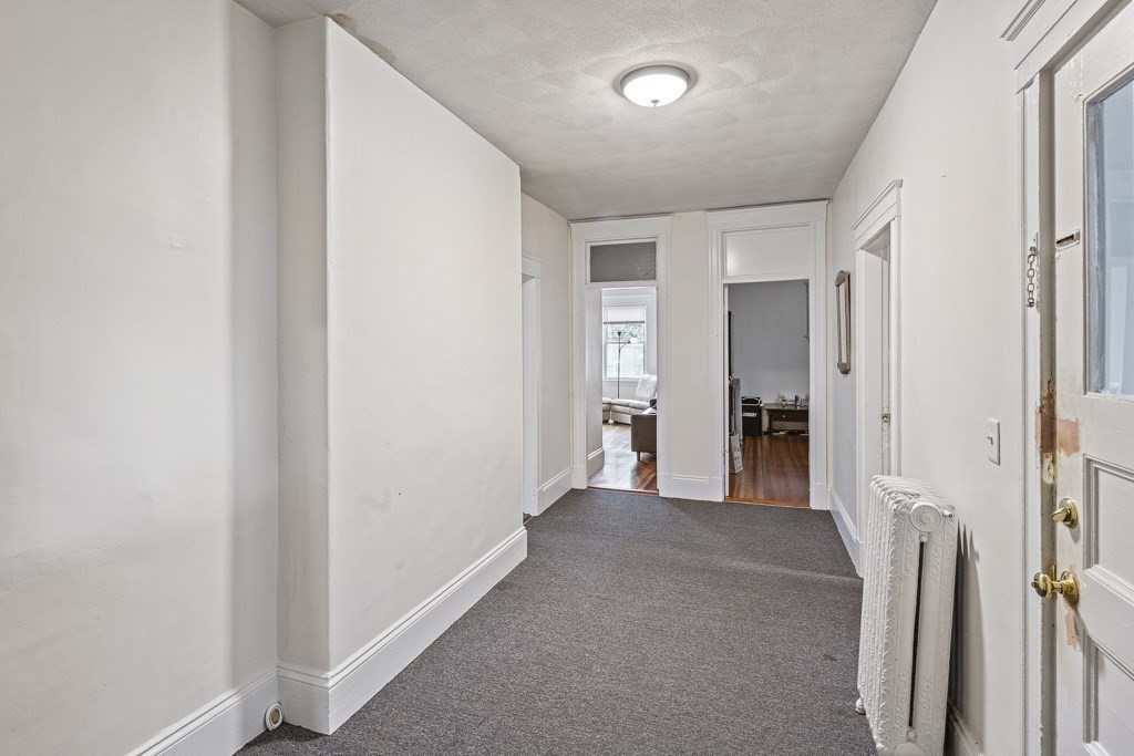 105 Walnut Street Somerville, MA 02145 - Photo 23 of 37 wooden floor and closet in a room