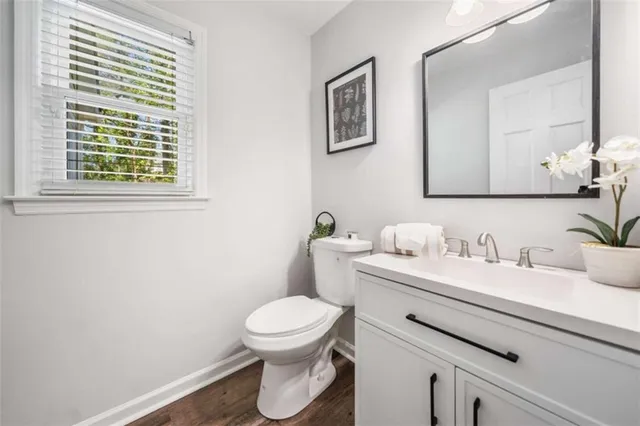 a view of kitchen with wooden floor and electronic appliances