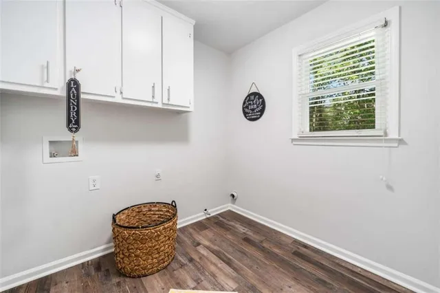 a view of a bedroom with furniture