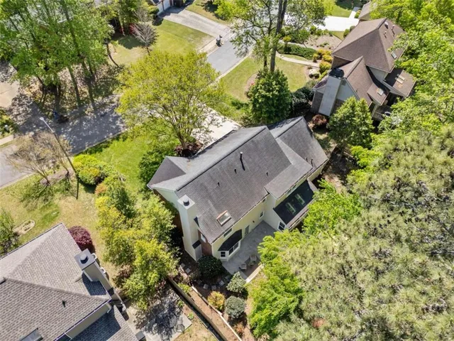 an aerial view of a house with a garden